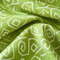 Soft lime green patterned fabric featuring a floral geometric design creates a vibrant and refreshing textile close-up ideal for various creative projects photo