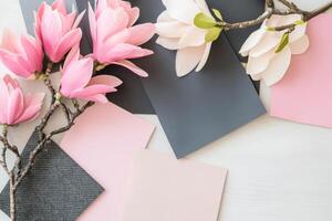Curated interior moodboard showcasing luxury textures and floral elements in a blush and charcoal color palette for design inspiration photo