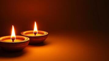 Two lit candles on a dark background photo