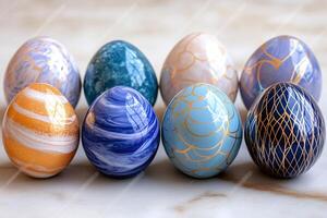 Eight easter eggs with modern patterns are waiting on a marble surface photo