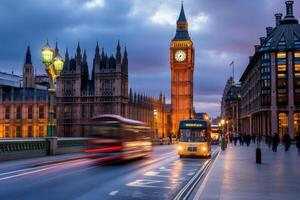 Buses driving on Westminster Bridge at dusk with Big Ben and Houses of Parliament in background, London, United Kingdom photo