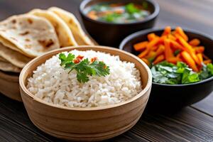 Steaming basmati rice with carrot and coriander salad and chapati bread photo