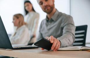 Working ,on a project together. Successful team are in the office. Conception of business photo