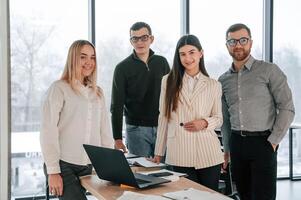 Unity, of the people. Successful team are working together in the office. Conception of business photo