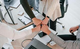 Unity of ,the people. Successful team are working together in the office. Conception of business photo