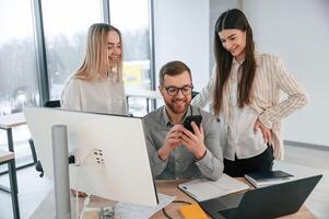 Having conversation about ,ideas. Successful team are working together in the office. Conception of business photo