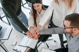 Unity of the people. Successful team are working together in the office. Conception of business photo