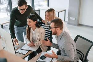 Unity, of ,the people. Successful team are working together in the office. Conception of business photo