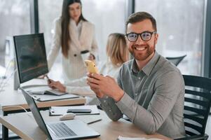 Working on a project together. Successful team are, in the office. Conception of business photo