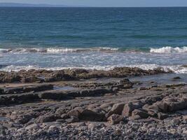 waves crashing on the beach photo