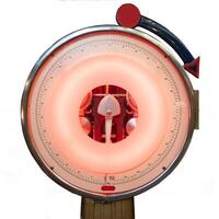 Retro analog weight scale with glowing circular display and calibration dial photo