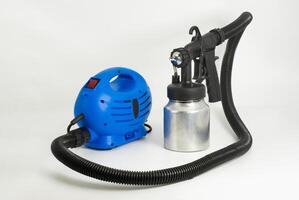 An used paint sprayer set suitable for various DIY projects and professional applications photo