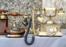 Old phone. A disk with numbers, a tube on a wire. First prototype. photo