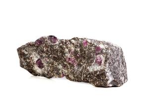 close-up Macro of a mineral Ruby stone on a white background photo