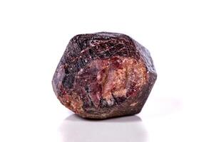close-up Macro of a mineral garnet stone on a white background photo