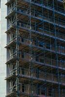 Building Facade with Scaffolding Construction in Manchester, UK. photo