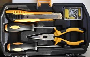 A collection of metalworking tools in a container. Repair instruments. photo