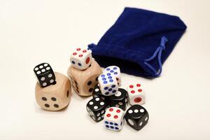 Gaming cubes against a white background. Different-sized dice. photo