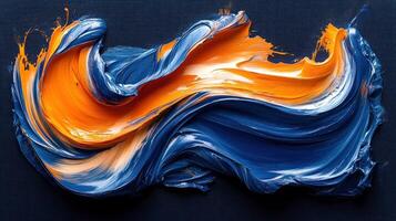 Abstract paint swirls of blue and orange on dark background photo