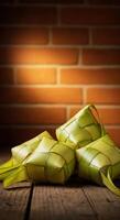 Three pieces of banana leaves on a wooden table photo