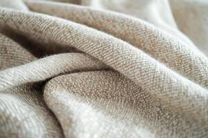 Soft beige home textiles creating a warm and inviting atmosphere for interior decor. textured beige fabric is draped elegantly, showcasing intricate patterns that add a cozy touch to any home decor photo