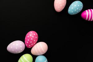 scattered easter egg black background empty blank copy space april event spring celebration photo
