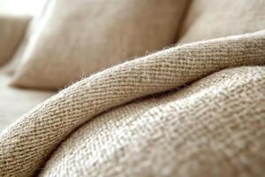 Close-up of cozy home textures showcasing a soft woven fabric couch in a modern living space during daylight. A detailed view of a soft woven fabric couch reveals the inviting textures of home decor photo