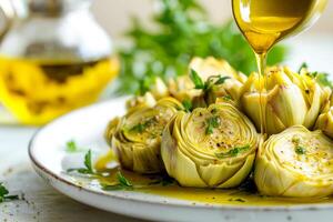 Grilled artichoke hearts drizzled with olive oil and garnished with fresh herbs. Freshly cooked artichoke hearts are served on a plate, generously drizzled with olive oil and sprinkled with herbs photo