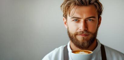 Barista showcasing latte art while holding coffee cup in a modern cafe setting during daytime. skilled barista with a beard presents a beautifully crafted cup of latte art on light background photo