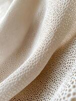 Soft beige home textures showcasing delicate patterns and intricate weaves for interior design inspiration. Subtle beige fabric drapes gently, revealing intricate patterns and textures photo