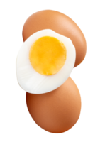 Front view of raw brown chicken eggs and cooked or boiled chicken egg with egg yolk in half in small pile isolated with clipping path in file format png