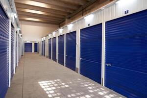 A long row of blue self storage units photo