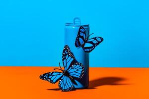 A blue and orange container with two butterflies on it photo