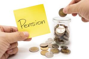 PENSION text on sticky note. Happy to placing a coin into a jar. Commitment to achieving financial goals. isolated on white background. Retirement concept. photo