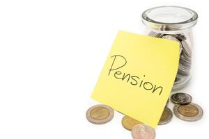 PENSION text on sticky note. Thai Baht Coins spilled out of jar glass isolated on white background, saving for future, Retirement concept. Copy Space for text. photo