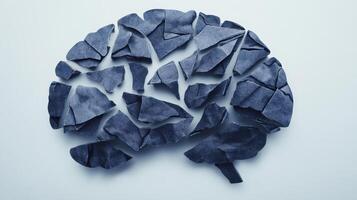 Creative representation of a fragmented brain made from denim fabric arranged on a light background illustrating the theme of mental health and creativity photo