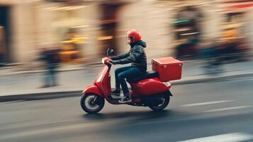 Delivery rider speeds through urban street during busy evening hours on a red scooter with cargo box photo