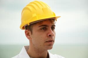 Engineer sad About Bad Work Done By Workers Nervously Scolding Them On Beach photo