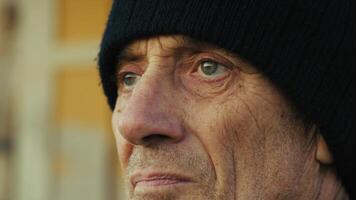 Old Worried Man Looks Around Close Up photo