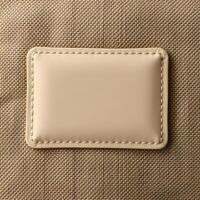 Detailed view of a small leather patch on the back of a beige fabric for mockup 2 photo