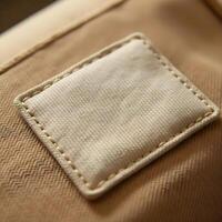 Detailed view of a small leather patch on the back of a beige fabric for mockup 1 photo