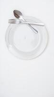 Spoon, Fork, and Plate of Tableware Set Isolated on White Background photo