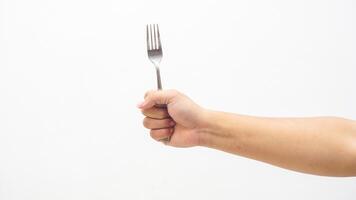 Hand Holding Fork Isolated on White Background photo