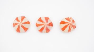 Orange stripped raw fish dumpling ball stuffed with chicken meat isolated on white background photo