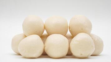 Uncooked fish ball made from processed fish paste or surimi isolated on white background photo
