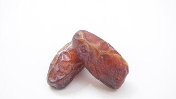 Delicious Dates Fruit for Ramadan Iftar Isolated on White Background photo