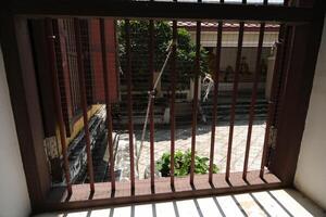 Shadow of an ancient window in Nakhon Luang Castle, Ayutthaya photo