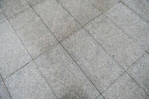 Grey tile floor, tile background photo