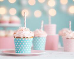 Delightful cupcake with pink frosting in polka dot wrapper, surrounded by soft bokeh lights, creating festive atmosphere perfect for celebrations photo