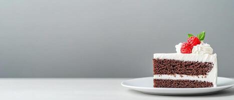 Delicious homemade cake slice on elegant plate, featuring layers of chocolate and cream, topped with fresh raspberries and mint leaves, perfect for dessert lovers photo
